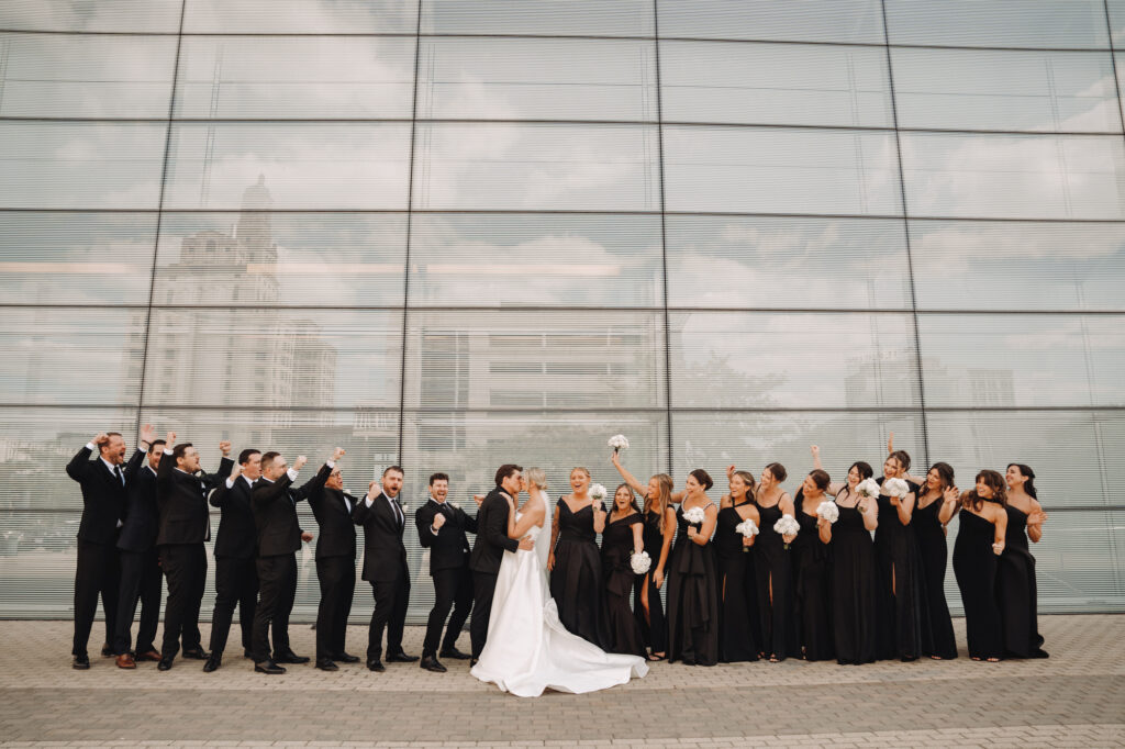 bridal party at the Figge cheering for the bride and groom